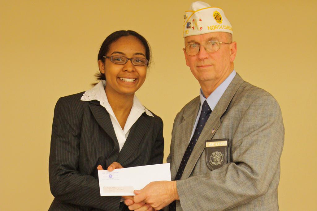 Randi Gibbs receiving her second place check from Division 1 Commander James Ervin. Randi becomes the alternate if Tyheim is unable to make the contest.